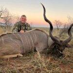 Photo of Hendrik with a large kudu prize.
