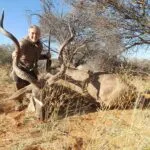 Lady hunter with her prize kudu.