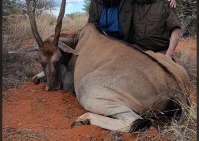 A hunting couple with their prize